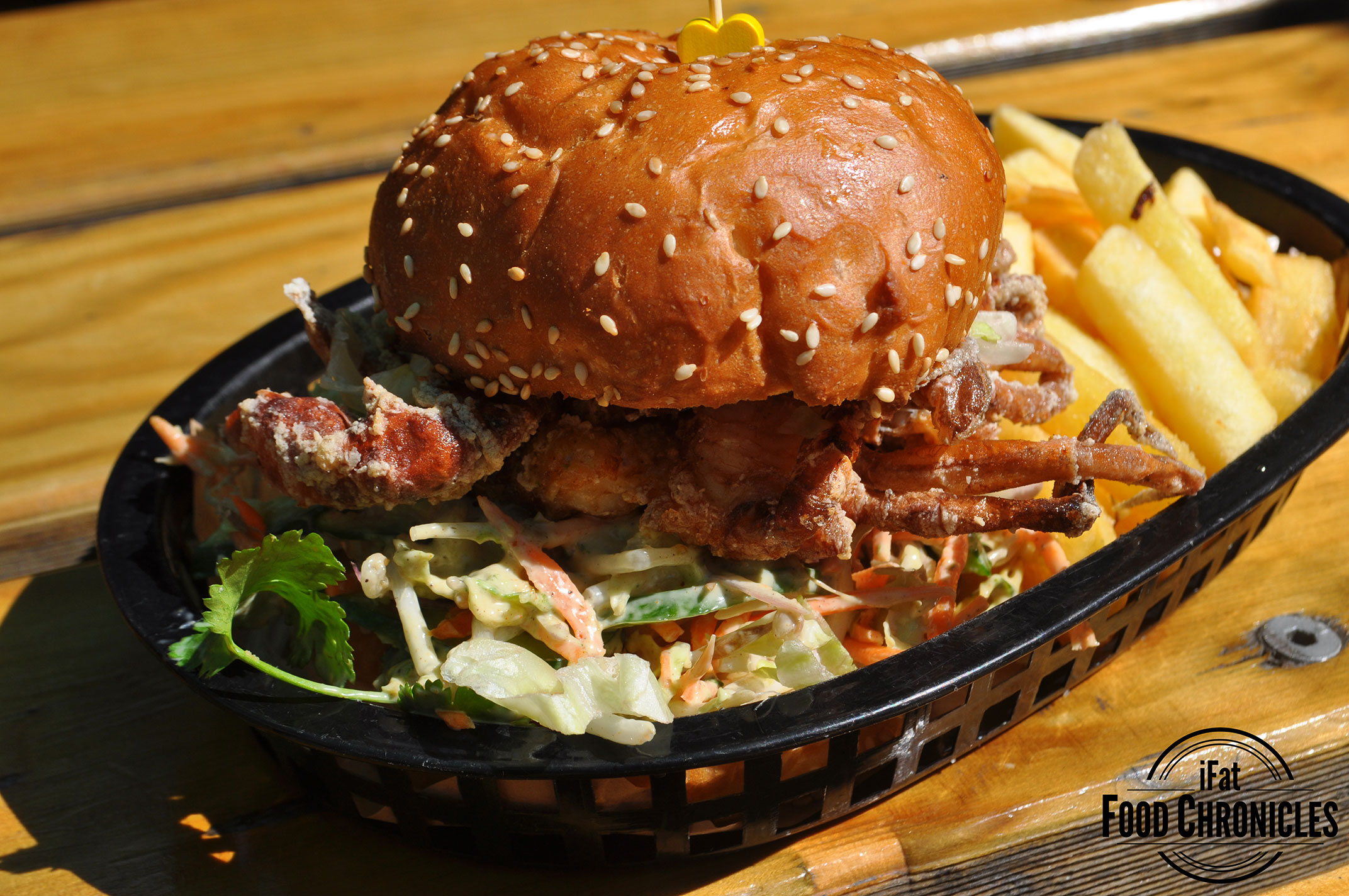 Soft shell crab burger with old bay coleslaw, ice-berg, sriarcha & chips