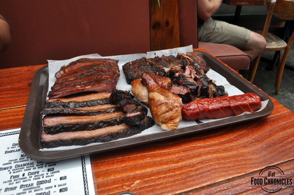 From top left (clockwise):  pork ribs, lamb ribs, dino ribs, smoked mega snag, chicken and beef brisket